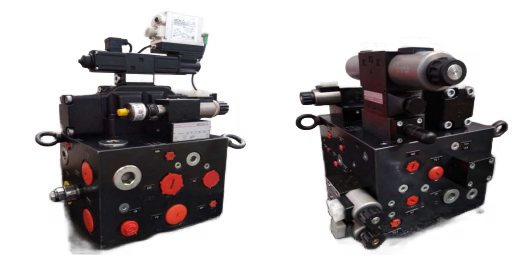 A precision-engineered hydraulic manifold block with multiple valves.